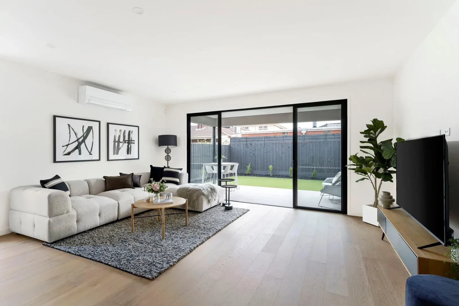 Nyah Street living area with large windows and timber flooring